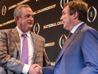 head coaches of Georgia and TCU shaking hands at a CFP Press Conference