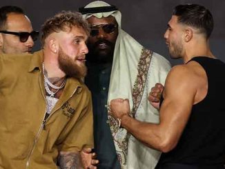 Jake Paul and Tommy Fury getting pulled apart at a press conference