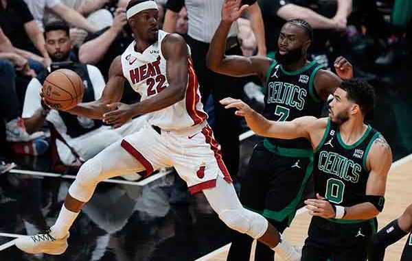 Jimmy Butler of the Miami Heat keeping the ball in play against the Boston Celtics