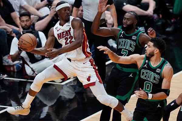 Jimmy Butler of the Miami Heat keeping the ball in play against the Boston Celtics