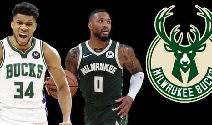 Giannis Antetokounmpo and Damian Lillard next to a Milwaukee Bucks logo