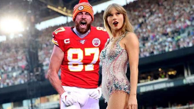Travis Kelce and Taylor Swift at a crowded NFL Stadium