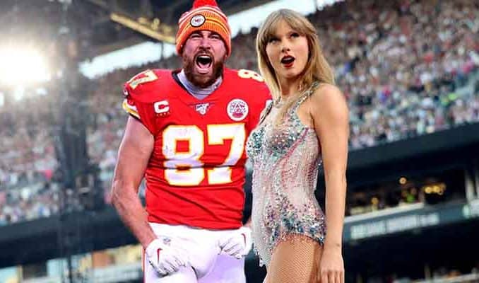 Travis Kelce and Taylor Swift at a crowded NFL Stadium