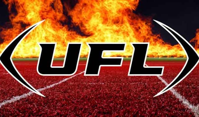 UFL logo over a football field on fire