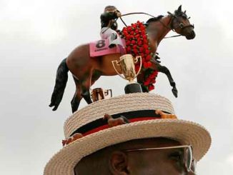 a Kentucky Derby hat with a racehorse on top of it