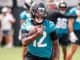 Travis Hunter running with the football during practice with the Jacksonville Jaguars